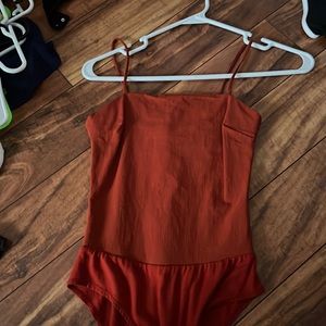orange bodysuit